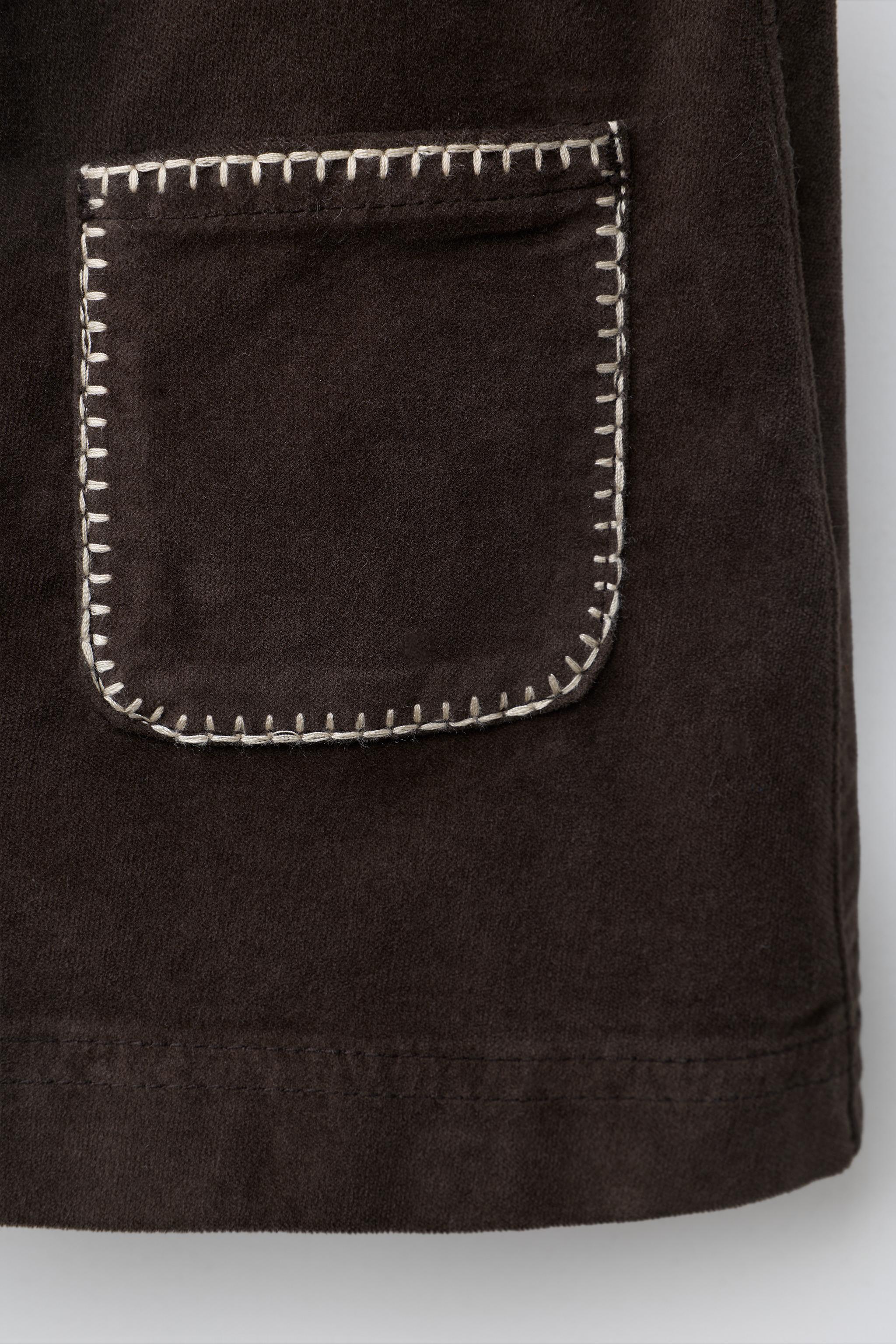 JUPE EN VELOURS À POCHES LISERÉES